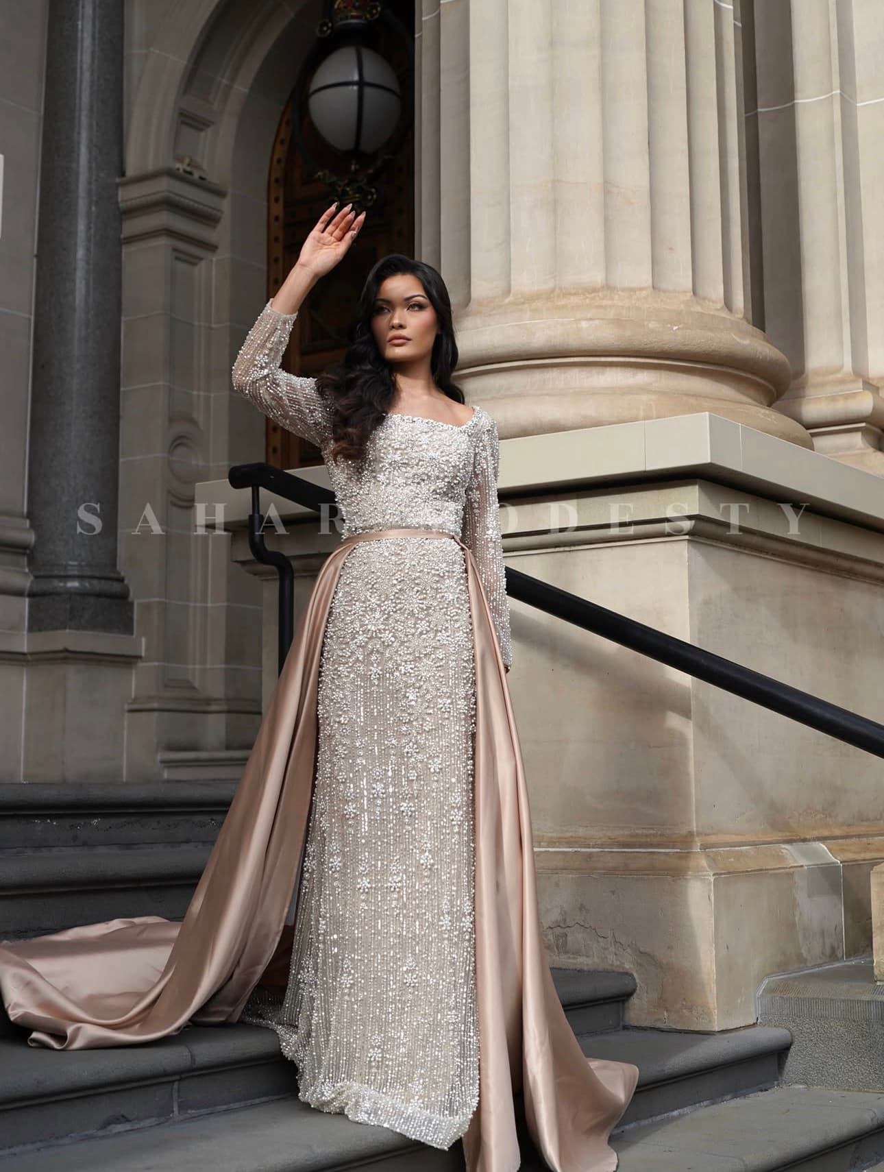 Champagne pearl modest gown with crystal bodice and satin overskirt.