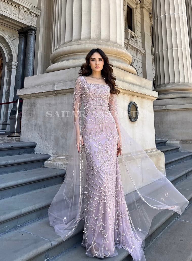 Lilac beaded modest gown photographed on stone steps.